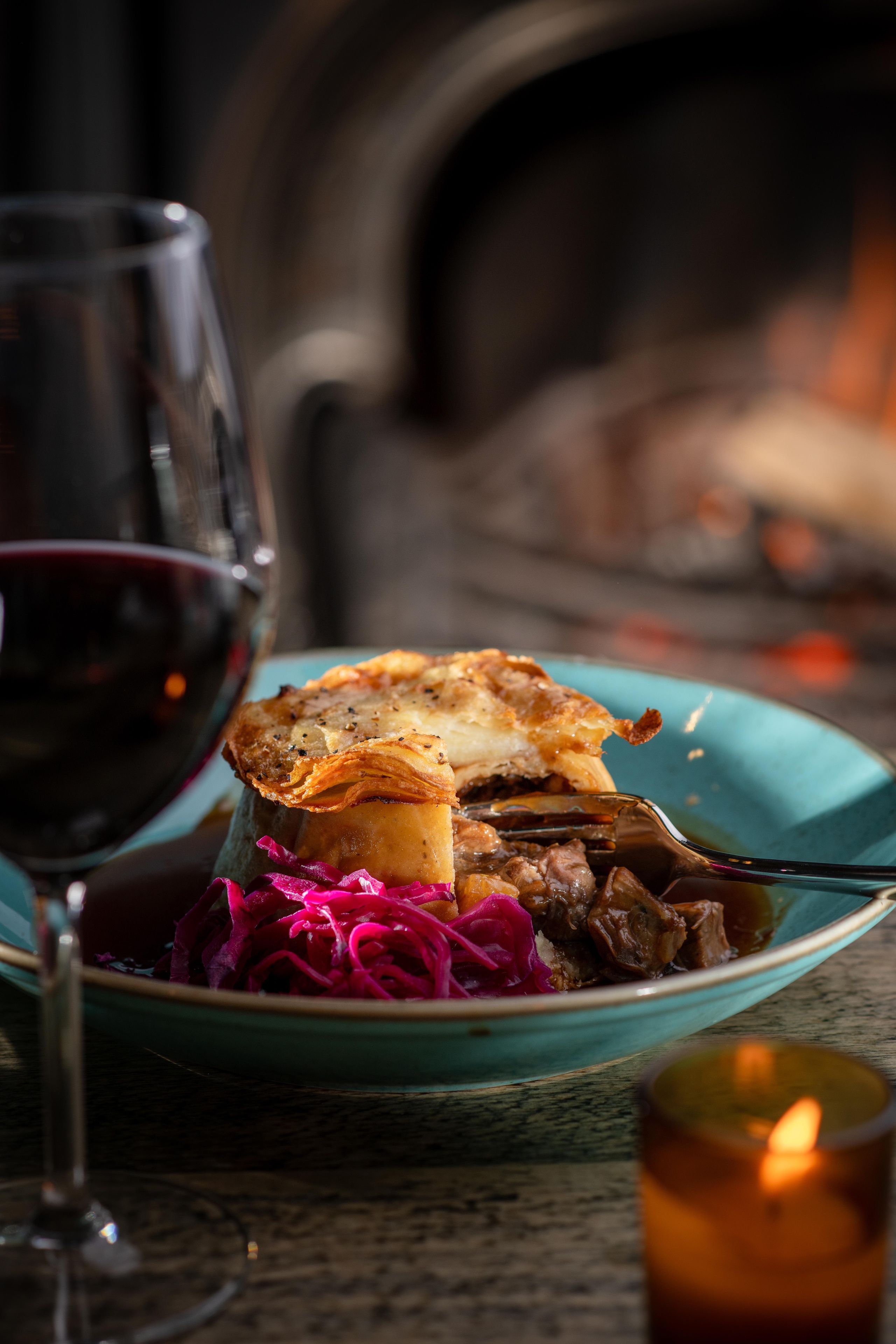 pie and red cabbage with wine by the fire