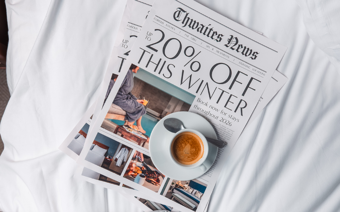 "up to 20% off this winter" newspaper with coffee on bed